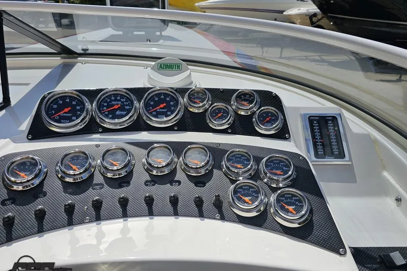 Slide: The Image of Dashboard of 1995 Wellcraft 29 Scarab boat with multiple gauges and controls. - 62