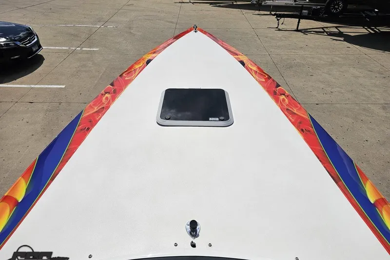 Slide: The Image of 1995 Wellcraft 29 Scarab boat with vibrant, colorful graphics on deck. - 67