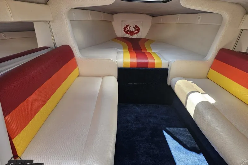 Slide: The Image of Interior of 1995 Wellcraft 29 Scarab boat with colorful seating and cozy cabin. - 73