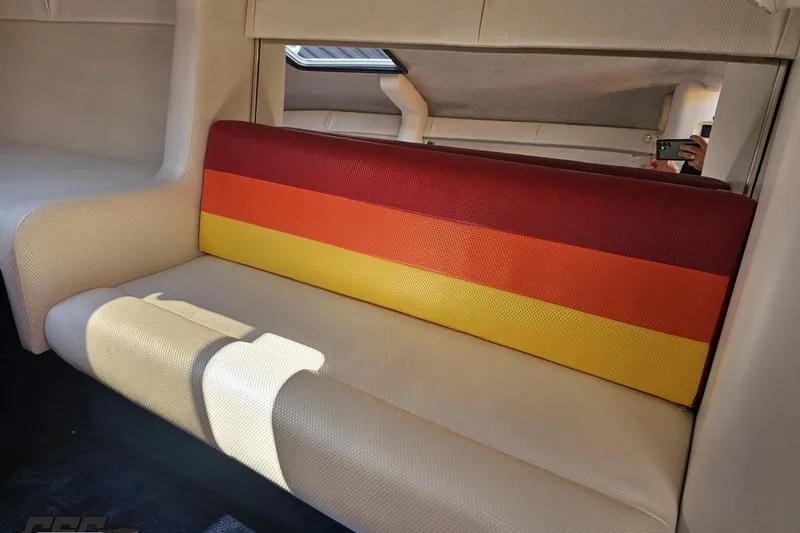 Slide: The Image of Interior of 1995 Wellcraft 29 Scarab with colorful striped seating. - 74