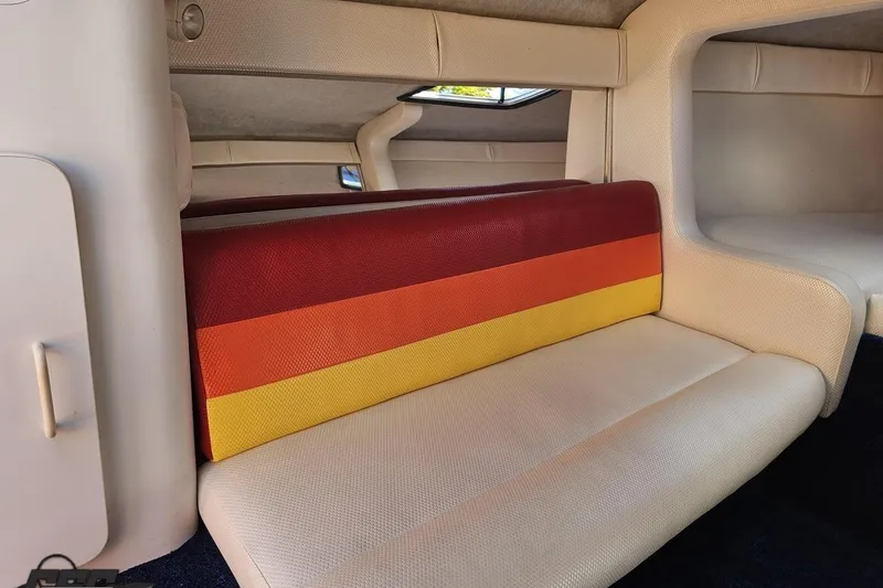 Slide: The Image of Interior of 1995 Wellcraft 29 Scarab boat with colorful seating and cozy cabin space. - 75