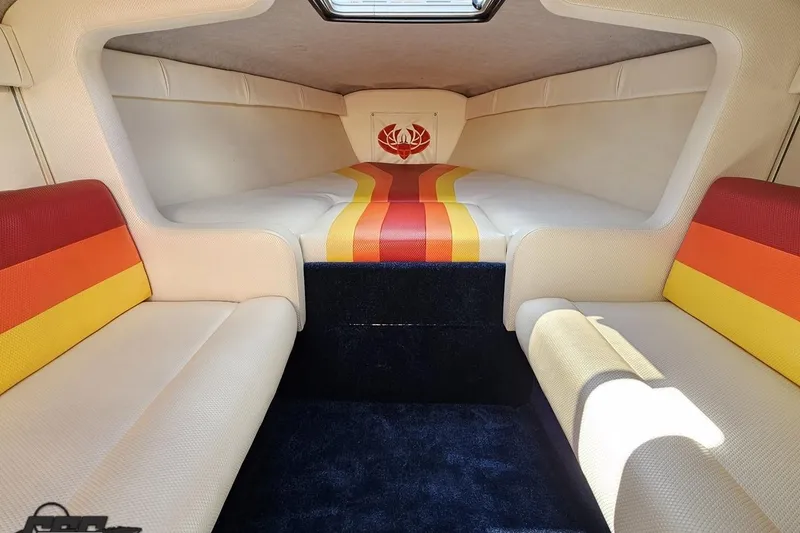 Slide: The Image of Interior of 1995 Wellcraft 29 Scarab boat with colorful seating and cozy cabin. - 76
