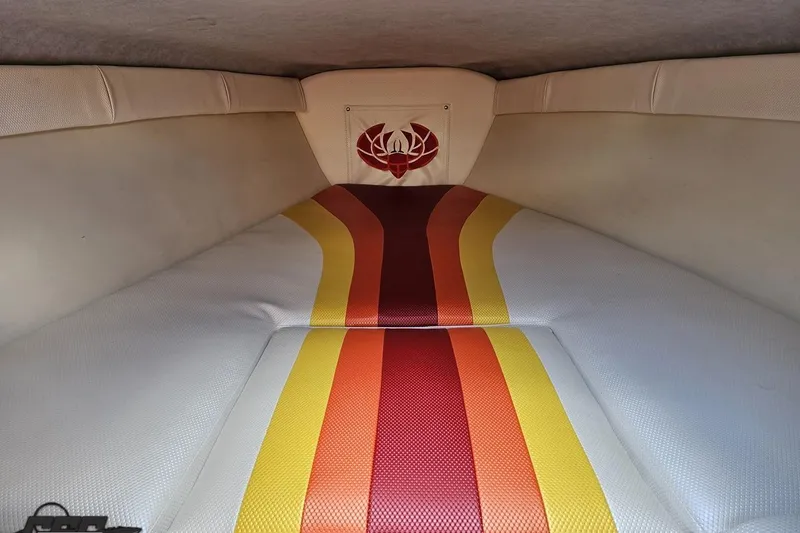 Slide: The Image of Interior of 1995 Wellcraft 29 Scarab boat with colorful striped upholstery. - 78