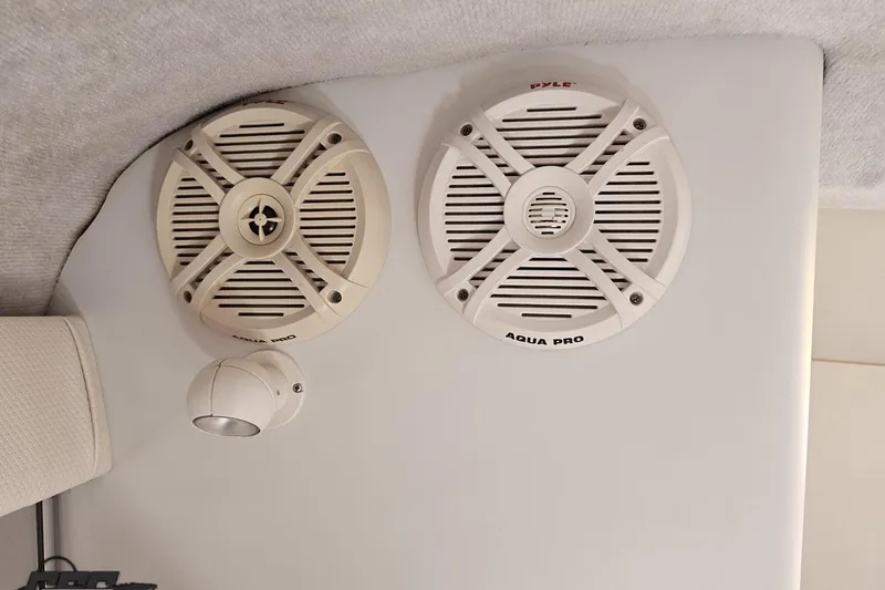 Slide: The Image of Speakers and light fixture inside 1995 Wellcraft 29 Scarab boat cabin. - 82