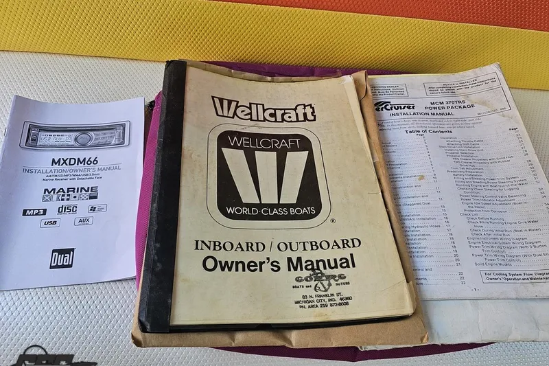 Slide: The Image of Owner's manuals for 1995 Wellcraft 29 Scarab boat and marine equipment. - 85