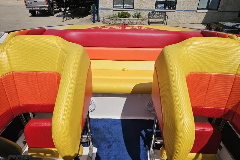 Slide: The Image of Colorful interior of a 1995 Wellcraft 29 Scarab boat with vibrant seating. - 89