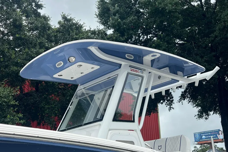 Slide: The Image of 2025 Sea Fox 268c Commander boat with sleek blue T-top design. - 15