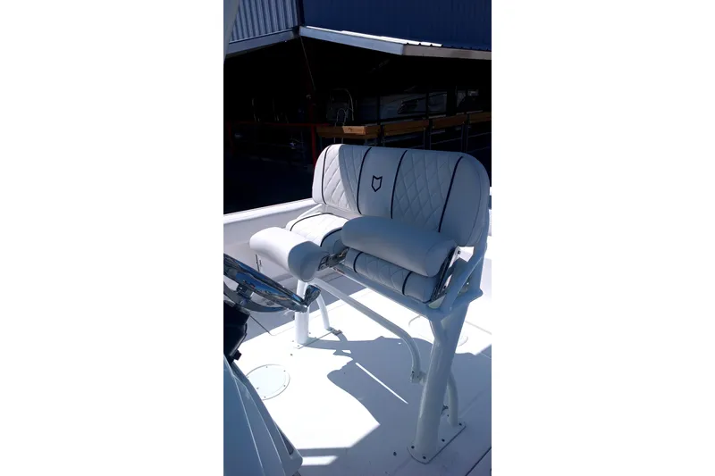 Slide: The Image of 2025 Sea Fox 268c Commander boat seat with white upholstery and diamond stitching. - 5