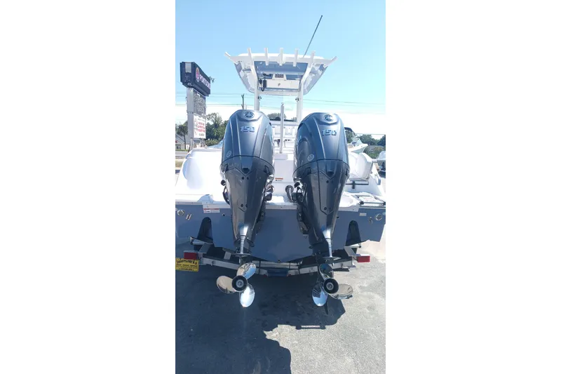 Slide: The Image of 2025 Sea Fox 268c Commander with dual outboard engines, rear view. - 6