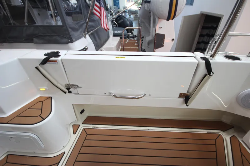 Slide: The Image of 2026 Ranger Tugs R-31 Command Bridge Luxury Edition, featuring teak deck and sleek design. - 15