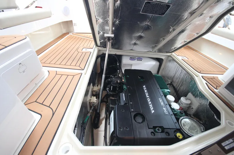 Slide: The Image of Engine compartment of 2026 Ranger Tugs R-31 Command Bridge Luxury Edition with Volvo Penta engine. - 24