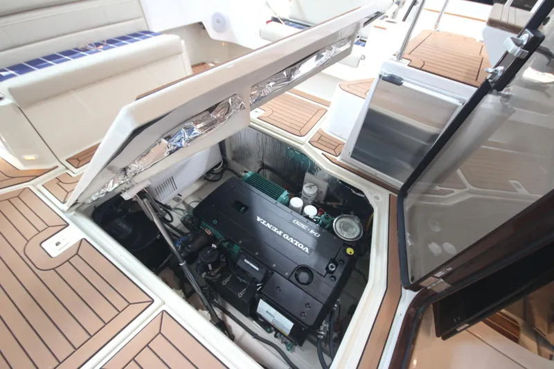 Slide: The Image of Engine compartment of 2026 Ranger Tugs R-31 Command Bridge Luxury Edition with Volvo Penta engine. - 25