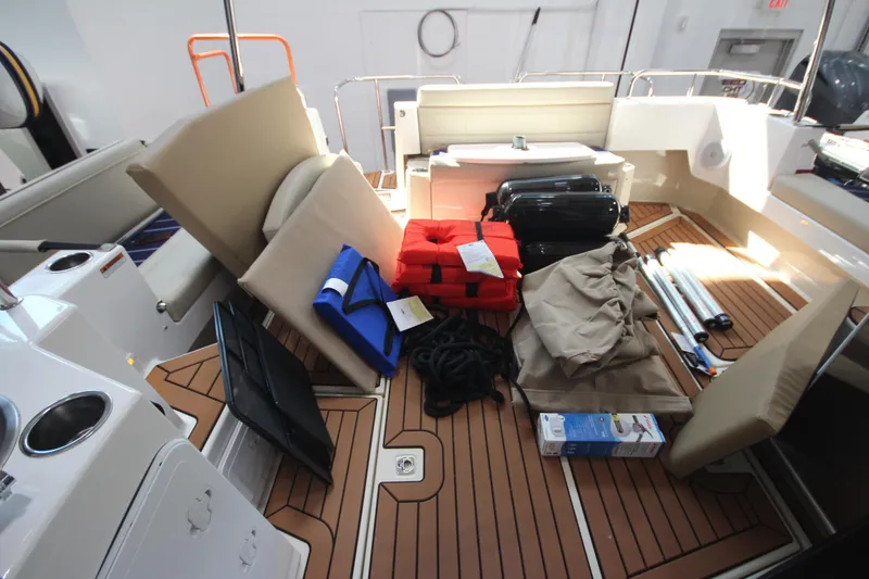Slide: The Image of 2026 Ranger Tugs R-31 Command Bridge interior with boating equipment and accessories. - 28