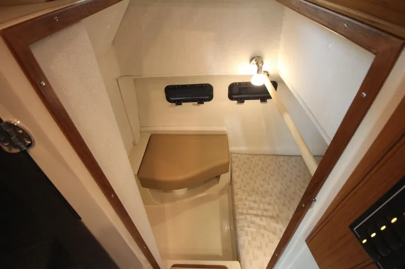 Slide: The Image of Interior of 2026 Ranger Tugs R-31 Command Bridge, featuring compact cabin space. - 29