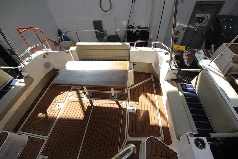 Slide: The Image of 2026 Ranger Tugs R-31 Command Bridge Luxury Edition, elegant deck seating and table. - 36