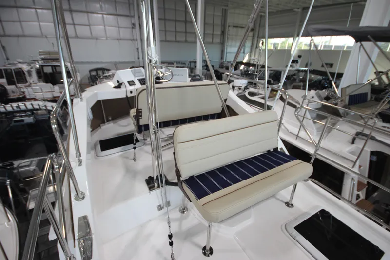 Slide: The Image of 2026 Ranger Tugs R-31 Command Bridge Luxury Edition interior with seating and helm controls. - 38