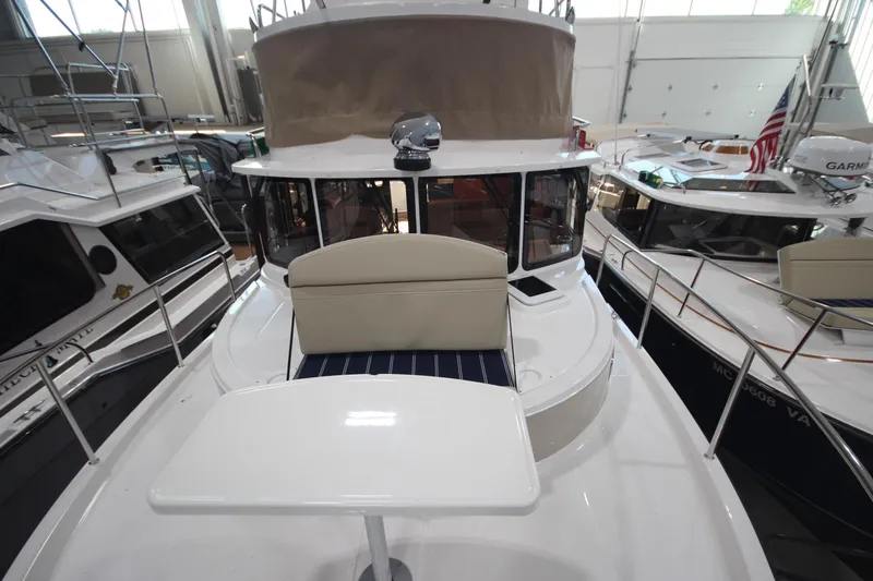 Slide: The Image of 2026 Ranger Tugs R-31 Command Bridge Luxury Edition in a showroom, showcasing sleek design. - 45