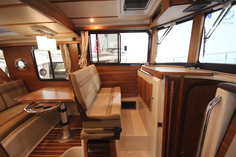 Slide: The Image of Interior of 2026 Ranger Tugs R-31 Command Bridge Luxury Edition, featuring elegant wood finishes. - 55
