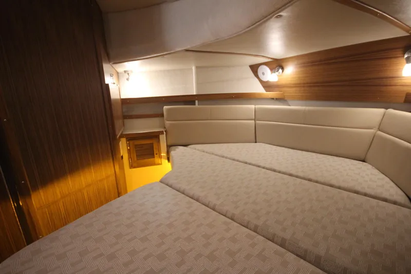 Slide: The Image of Luxurious interior cabin of 2026 Ranger Tugs R-31 Command Bridge, featuring elegant wood and lighting. - 63