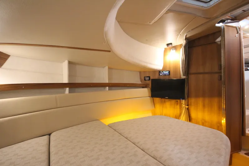 Slide: The Image of 2026 Ranger Tugs R-31 Command Bridge Luxury Edition interior with cozy seating and ambient lighting. - 64