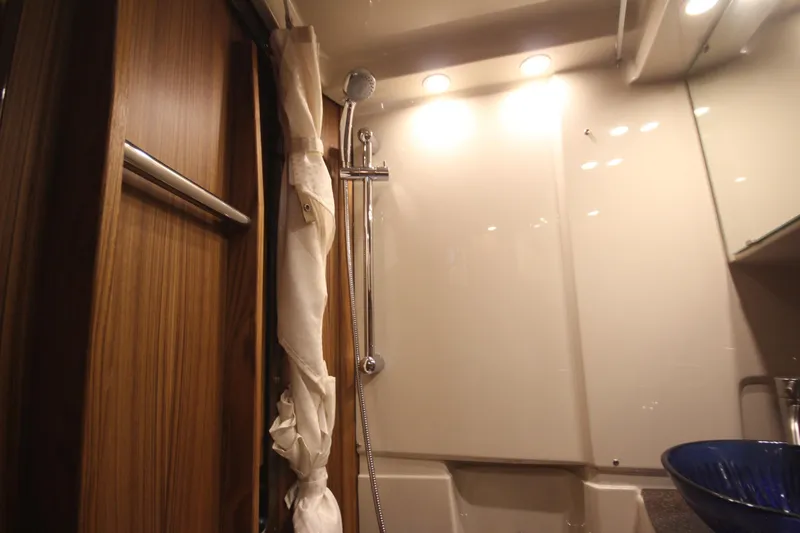 Slide: The Image of Luxurious bathroom in 2026 Ranger Tugs R-31 Command Bridge yacht, featuring modern shower and sink. - 67
