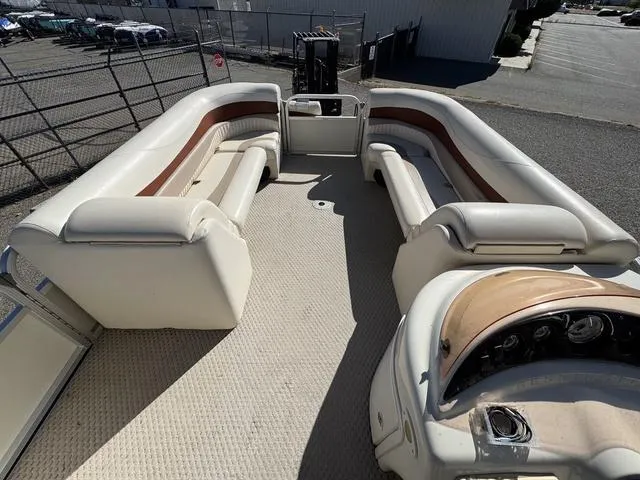 Slide: The Image of 2007 Bennington 2275 GL pontoon boat interior with spacious seating and helm. - 18