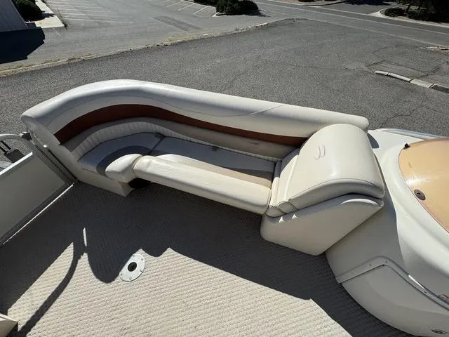 Slide: The Image of 2007 Bennington 2275 GL boat interior with beige seating and brown accents. - 20