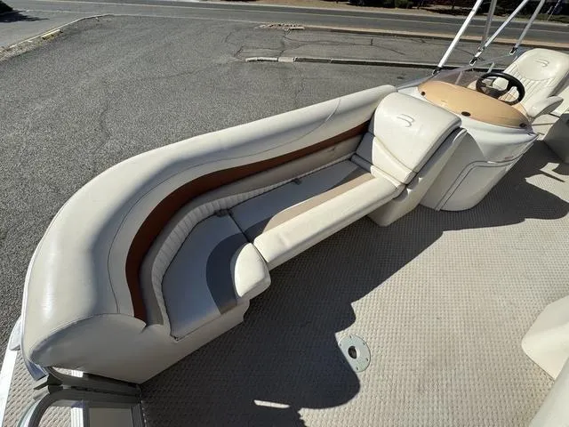 Slide: The Image of 2007 Bennington 2275 GL boat interior with beige seating and steering console. - 21