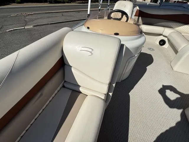 Slide: The Image of 2007 Bennington 2275 GL boat interior with beige seating and steering console. - 22