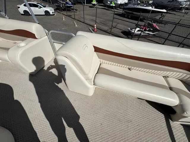 Slide: The Image of 2007 Bennington 2275 GL boat interior with beige seating and carpet. - 24
