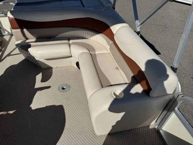 Slide: The Image of 2007 Bennington 2275 GL boat interior with beige and brown seating. - 26