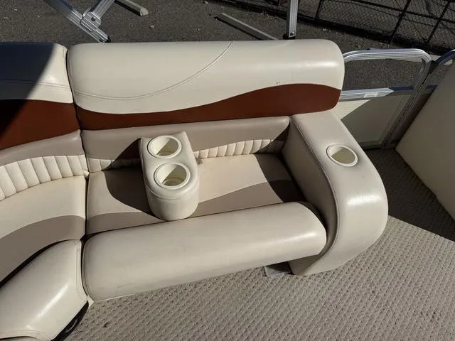 Slide: The Image of 2007 Bennington 2275 GL boat seating with cup holders, beige and brown upholstery. - 29
