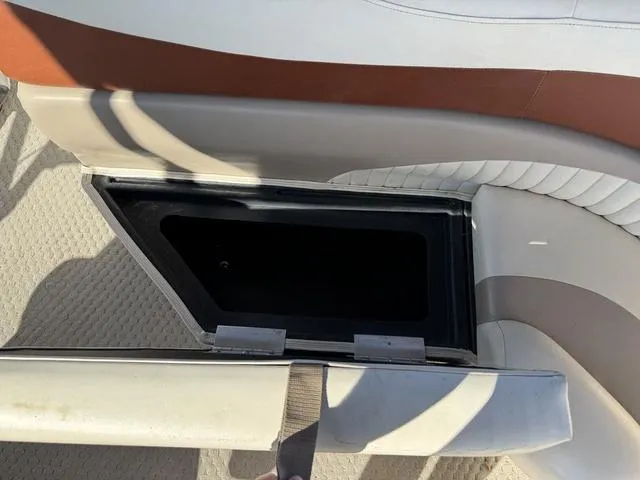 Slide: The Image of Open storage compartment on a 2007 Bennington 2275 GL boat seat. - 30