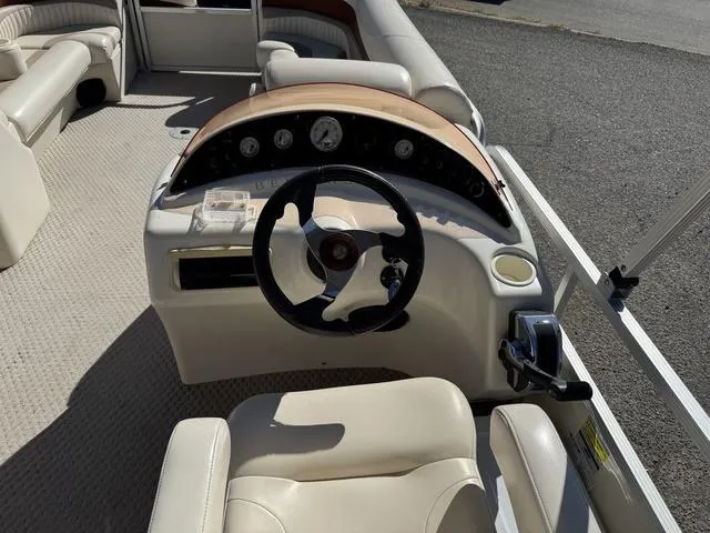 Slide: The Image of 2007 Bennington 2275 GL boat interior with steering wheel and dashboard controls. - 31