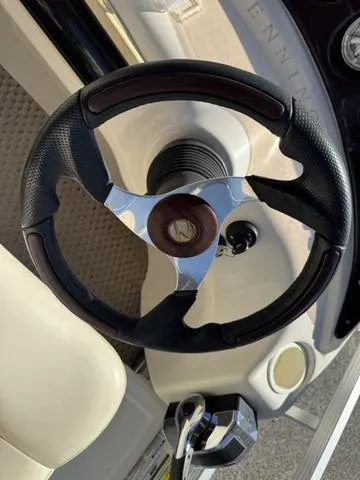 Slide: The Image of Steering wheel of a 2007 Bennington 2275 GL boat, featuring a sleek design. - 37