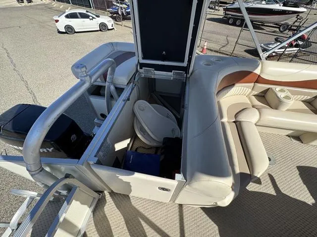 Slide: The Image of 2007 Bennington 2275 GL pontoon boat interior with seating and storage compartments. - 39