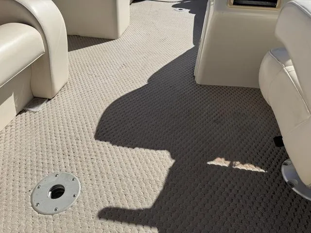 Slide: The Image of Interior of a 2007 Bennington 2275 GL boat with beige carpet and seating. - 43