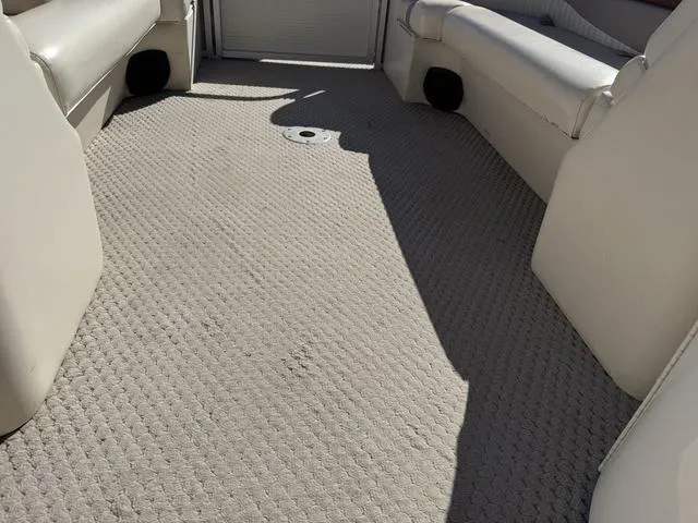 Slide: The Image of 2007 Bennington 2275 GL boat interior with beige carpet and seating. - 44