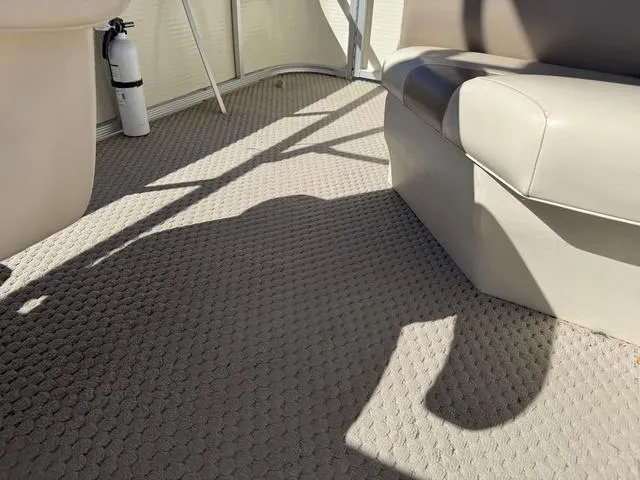 Slide: The Image of Interior of a 2007 Bennington 2275 GL boat with carpet and seating. - 45