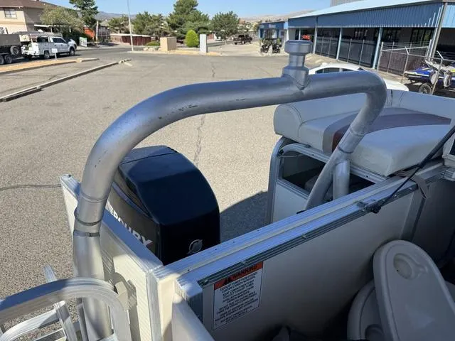 Slide: The Image of 2007 Bennington 2275 GL pontoon boat with Mercury engine, parked outdoors. - 47