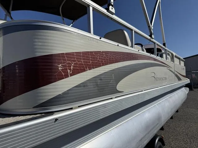 Slide: The Image of 2007 Bennington 2275 GL pontoon boat with visible exterior wear and tear. - 8