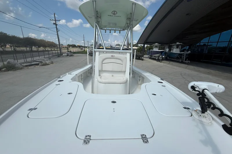 Slide: The Image of 2022 Sea Hunt BX 22 BR boat, white deck, outdoor display, clear sky. - 10