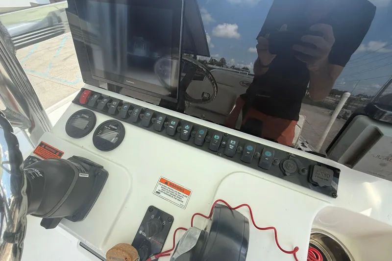 Slide: The Image of Control panel of 2022 Sea Hunt BX 22 BR boat with gauges and switches. - 14