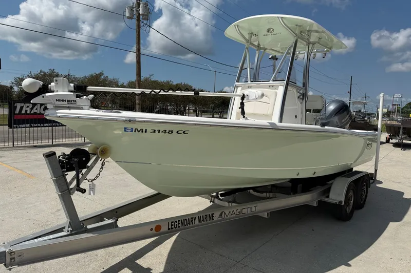 Slide: The Image of 2022 Sea Hunt BX 22 BR boat on trailer, displayed outdoors under clear sky. - 3