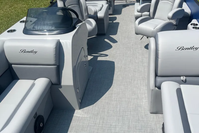 Slide: The Image of 2025 Bentley Pontoons Legacy QSB interior with luxurious seating and modern design. - 10
