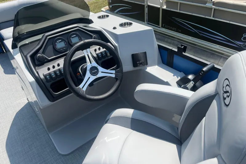 Slide: The Image of 2025 Bentley Pontoons Legacy QSB helm with modern steering and controls. - 11