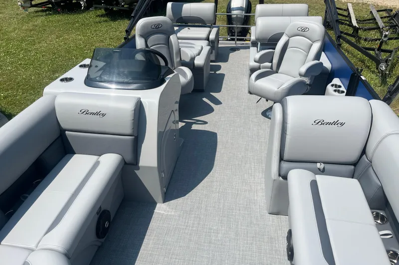 Slide: The Image of 2025 Bentley Pontoons Legacy QSB interior with luxurious seating and modern design. - 9
