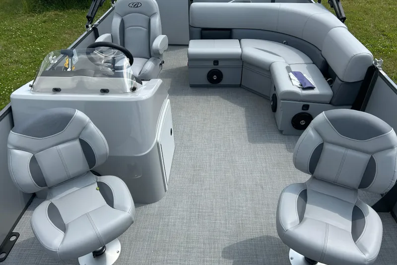 Slide: The Image of 2025 Bentley Pontoons LE 180 3PT interior with plush seating and modern helm design. - 11