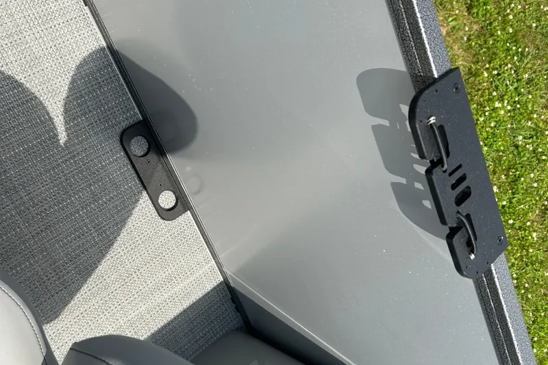 Slide: The Image of 2025 Bentley Pontoons LE 180 3PT interior detail with gray upholstery and hardware. - 16