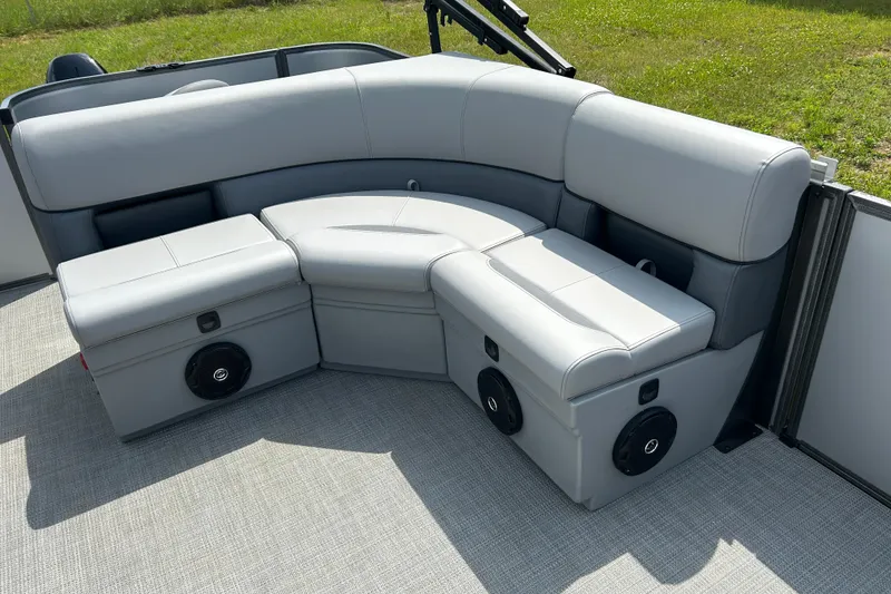 Slide: The Image of 2025 Bentley Pontoons LE 180 3PT interior seating with gray upholstery and built-in speakers. - 17